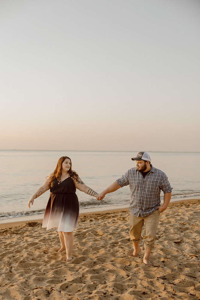 A couple walks together on the beach at Terrapin on Kent Island.