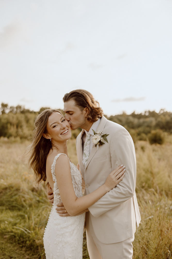 wedding couple sunset portraits in field at sunset